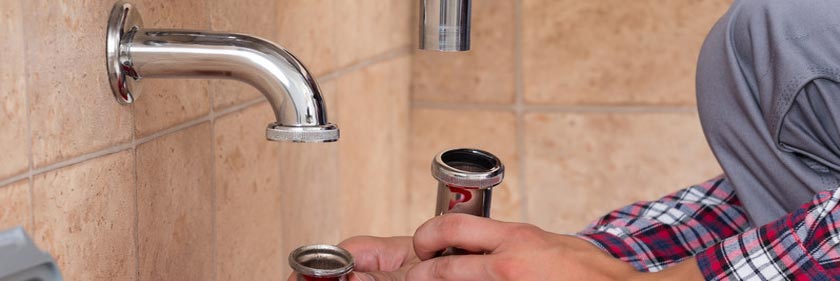 Drain Cleaning Service - Plumber fixing sink