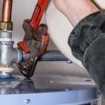 Improve your water quality / water heater - Plumber Fixing Water Heater